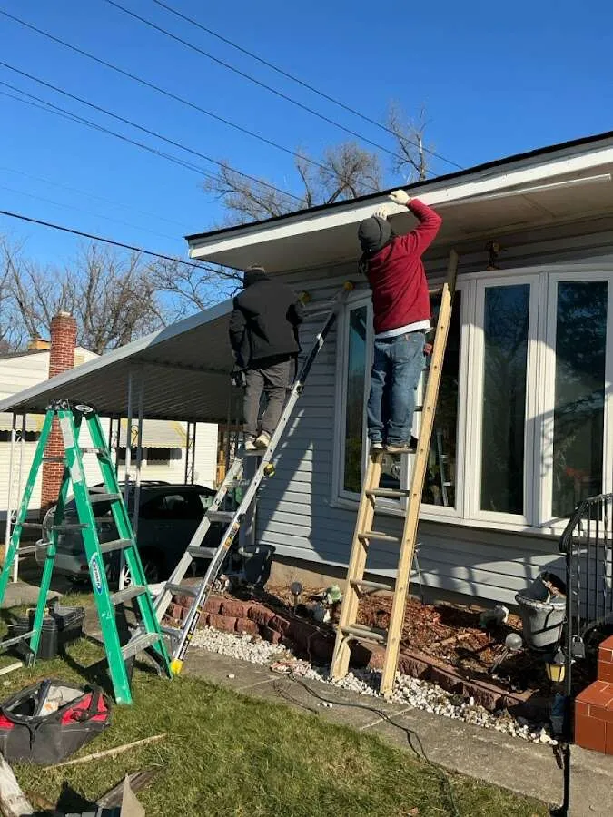 Restoration crew performing exterior repair in Hooper